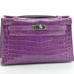 Pochette Kelly en crocodile violet